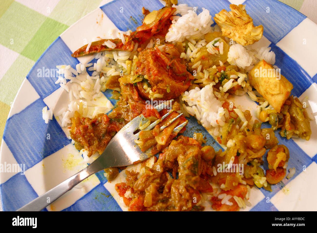 A plate of Indian takeaway food rice and curry Stock Photo