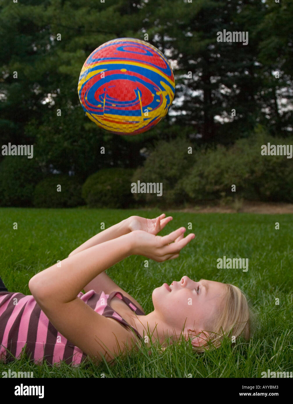 Child throwing a ball into the air Stock Photo Alamy
