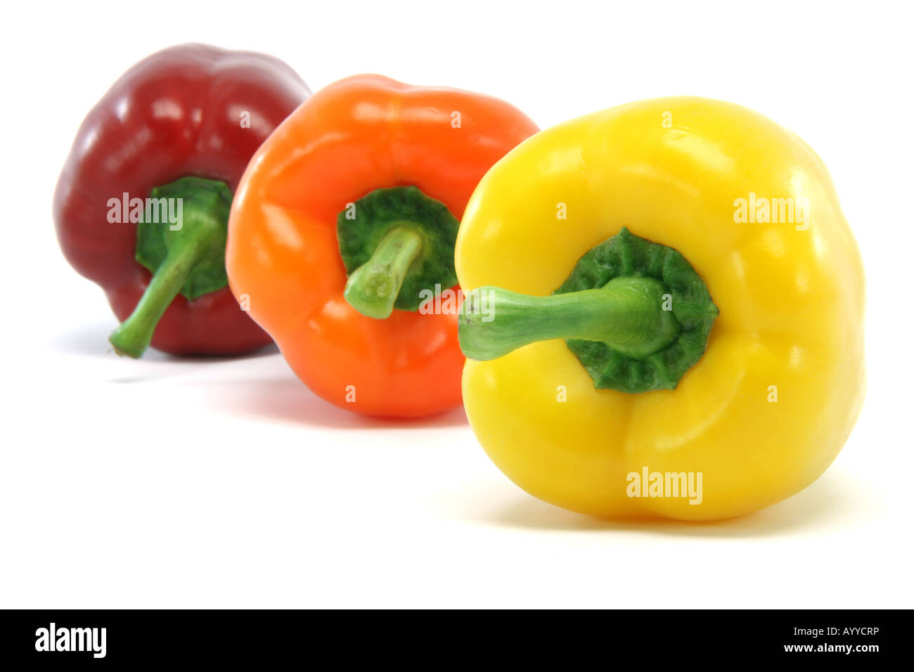 clor peppers focus on yellow one closeup isolated on white background food and vegetables concepts Stock Photo