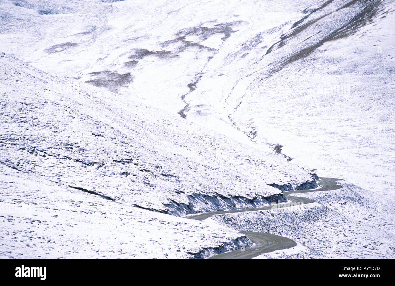 Winding road through mountain covered hi-res stock photography and ...
