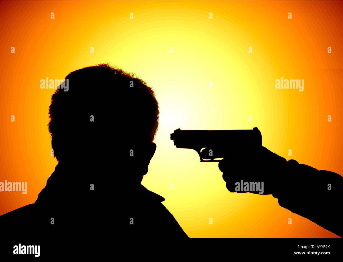 silhouette of hand gun pointed at head of man Stock Photo