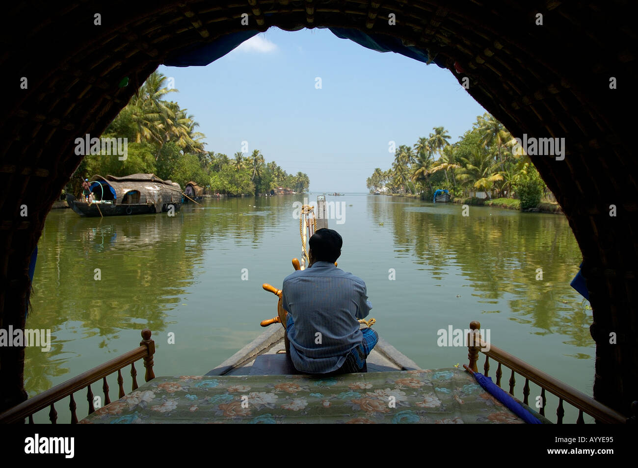 View of backwaters from Houseboat a popular tourist activity in Kerala South India Stock Photo