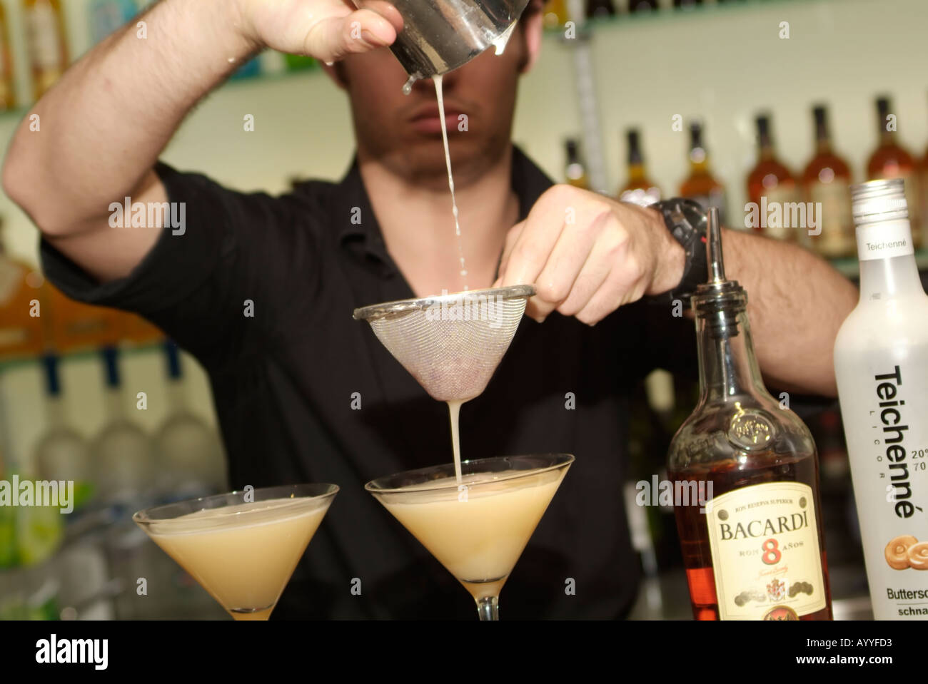 bartender pouring cocktail drink Stock Photo