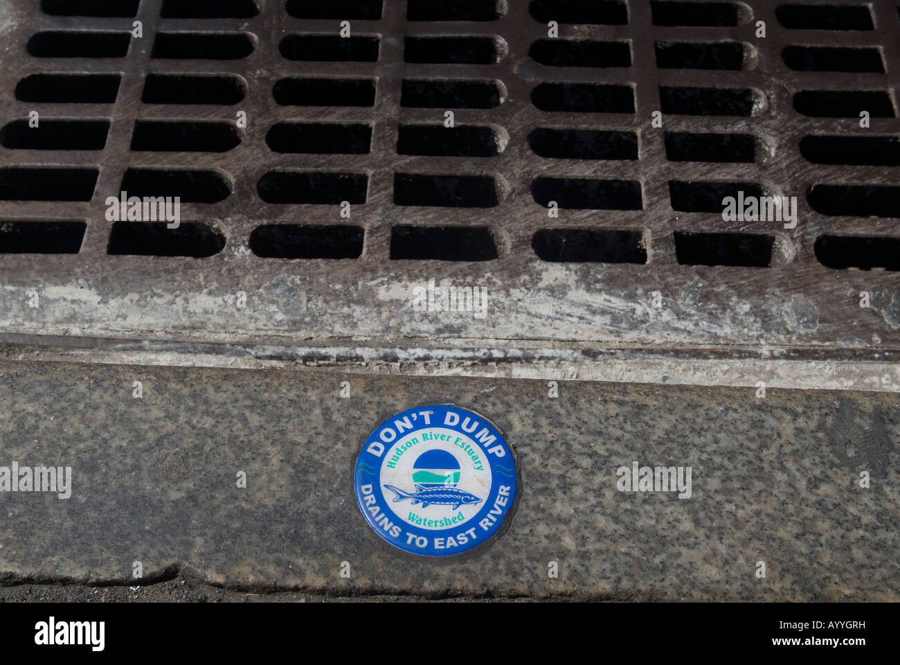 Storm drain with waste water warning Stock Photo