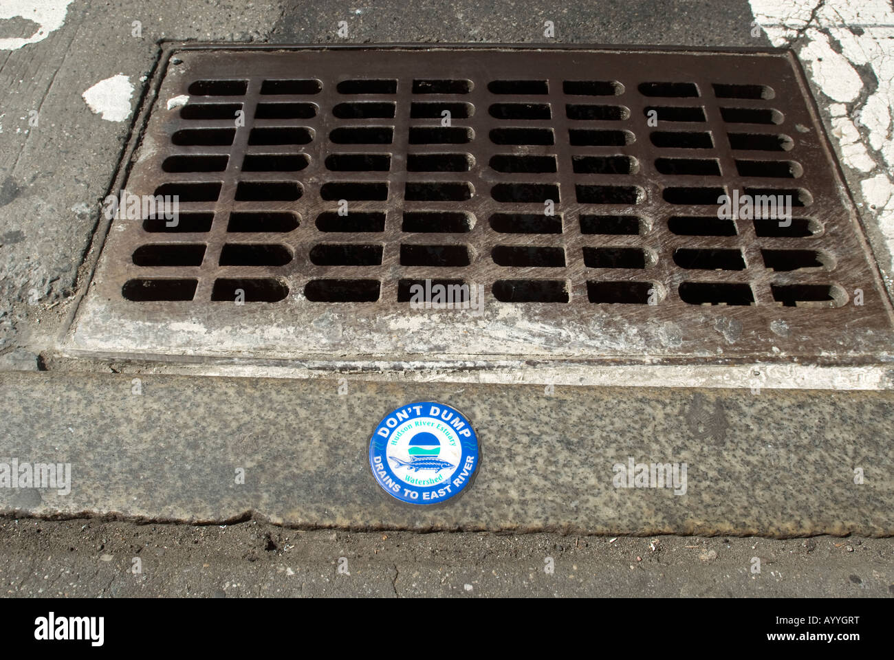 Storm drain with waste water warning Stock Photo
