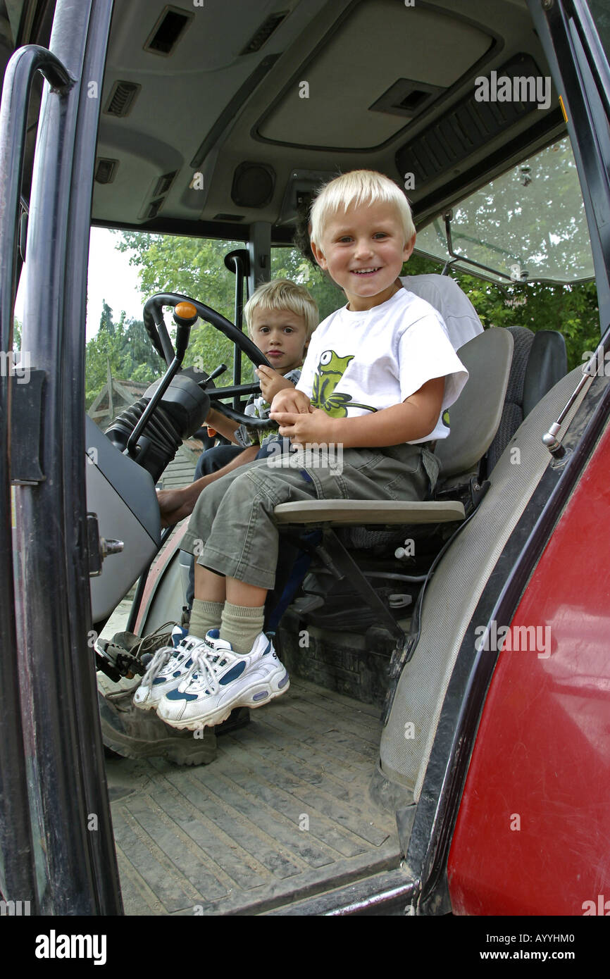 children are allowed to go with tractor Stock Photo