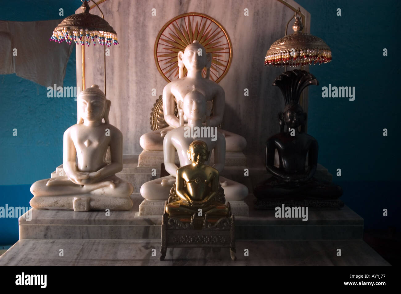 Jain temple interior statues of Mahavira or Mahavir Varanasi Uttar Pradesh India Stock Photo