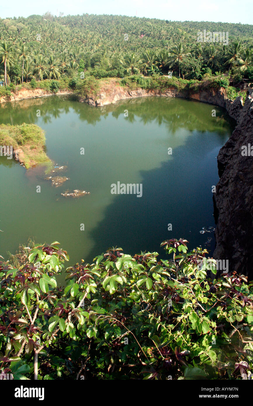 Back to the wild – aerial overhead view of a quarry pool reclaimed by nature Stock Photo