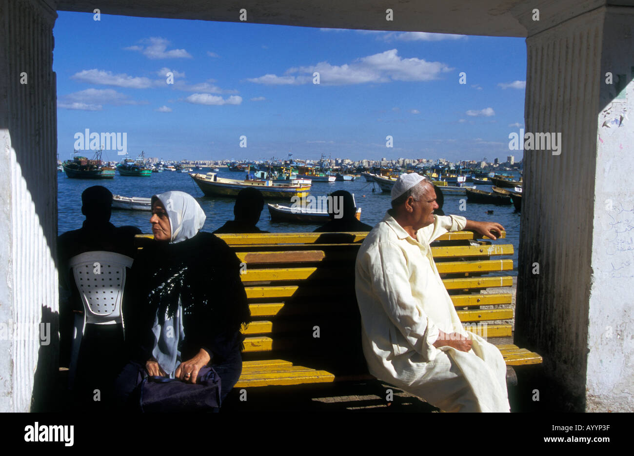 Waiting at a bus stop along the Corniche, Alexandria, Egypt. Stock Photo