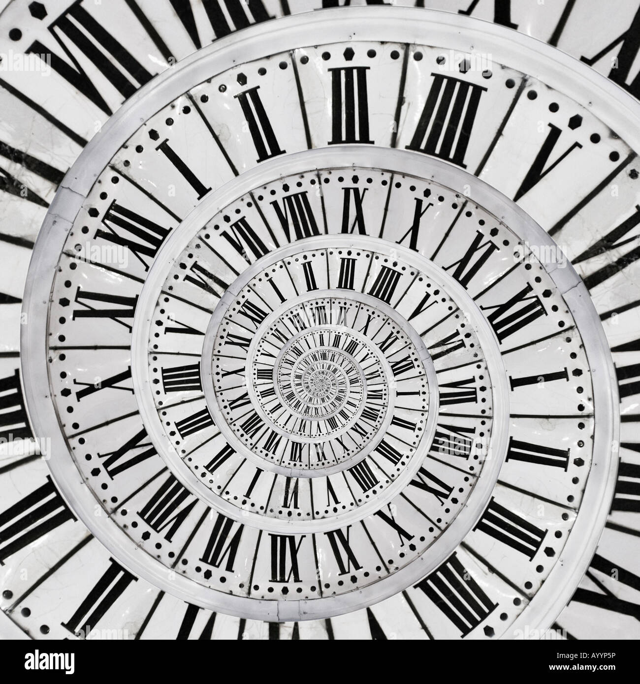 Placement at the centre of an old clock face of a small copy of the same clock face. Mise en abîme d'un cadran d' horloge. Stock Photo