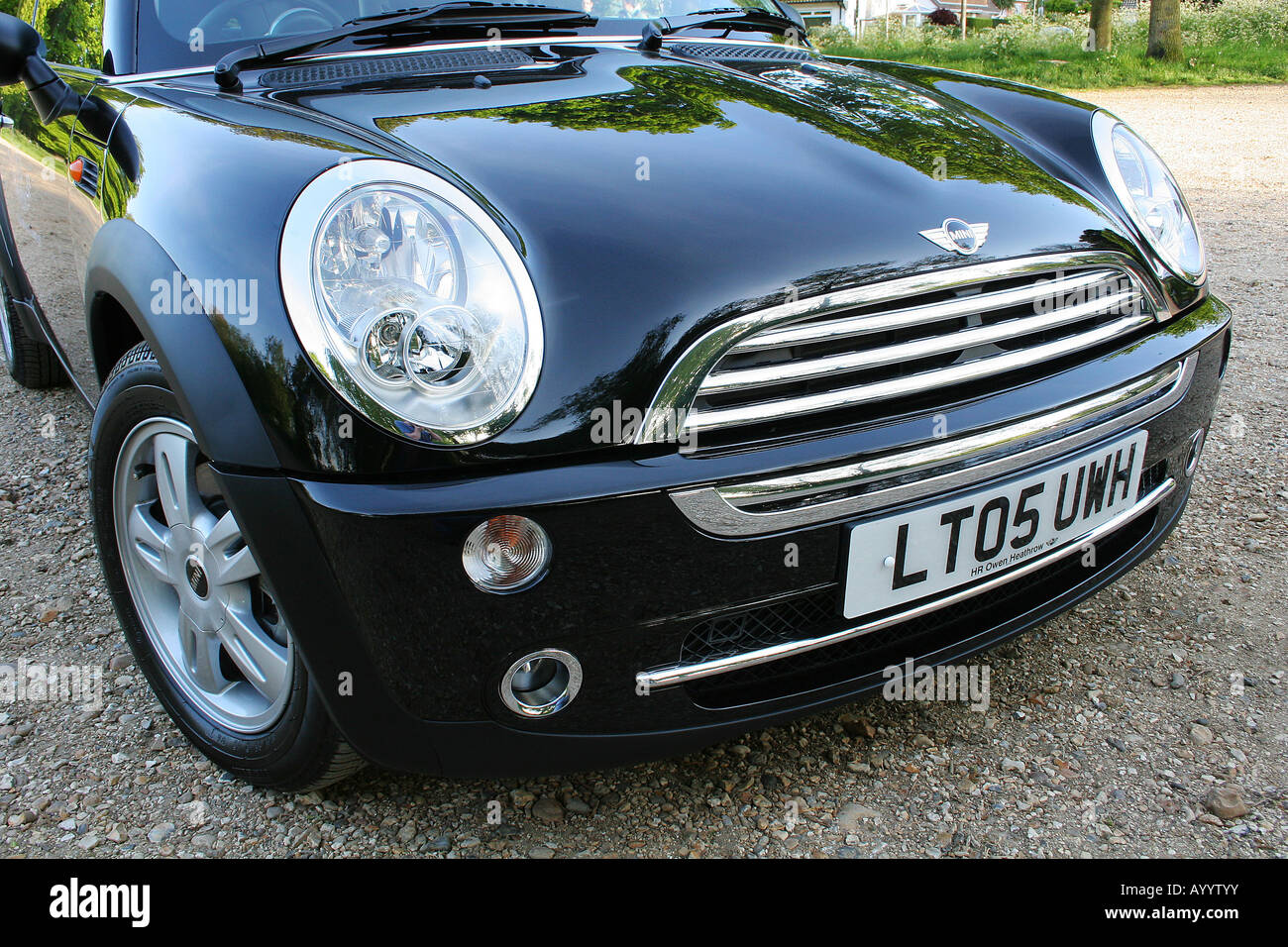 The front end of a black mini cooper. Stock Photo