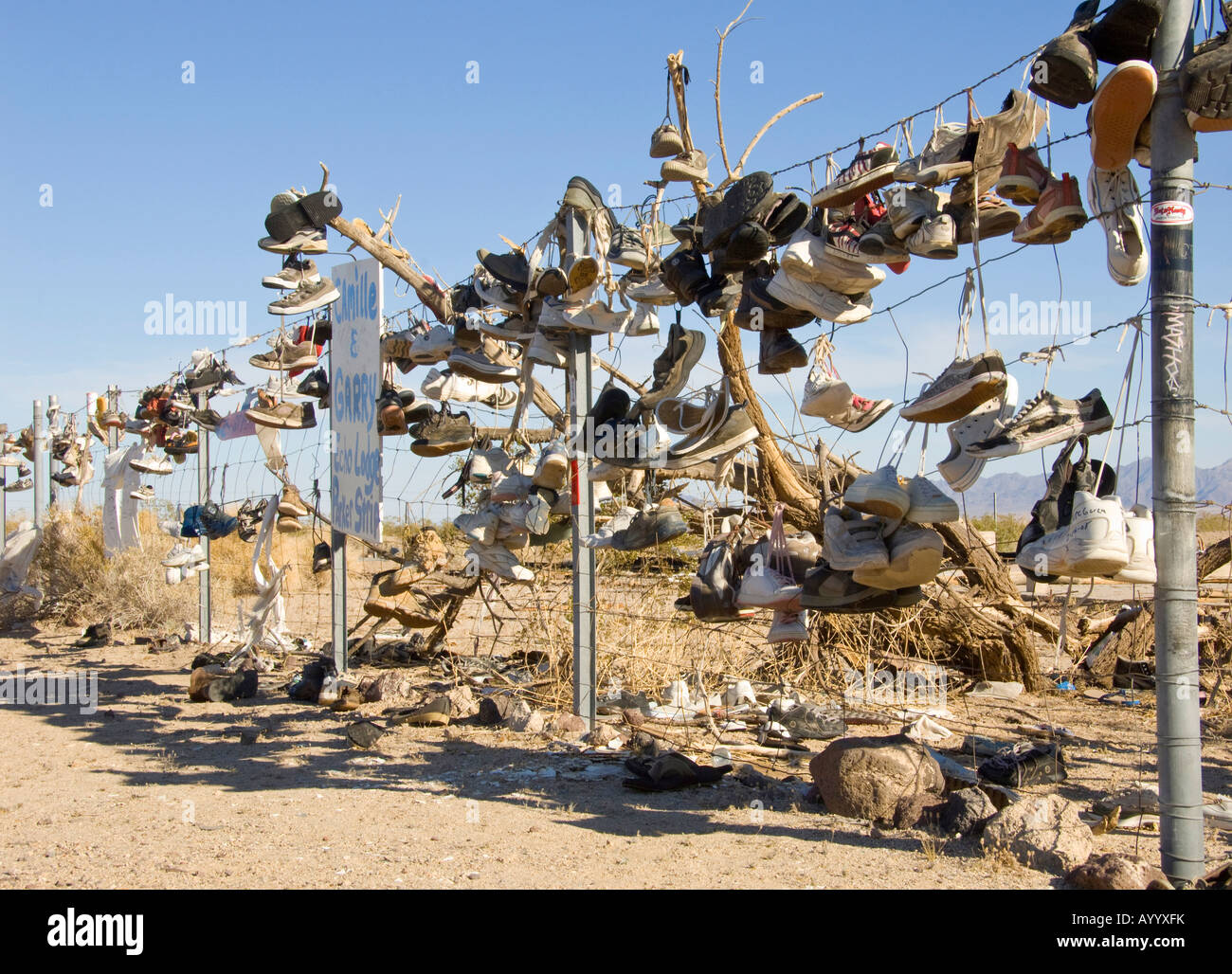 hundreds of shoes on a fence Stock Photo Alamy