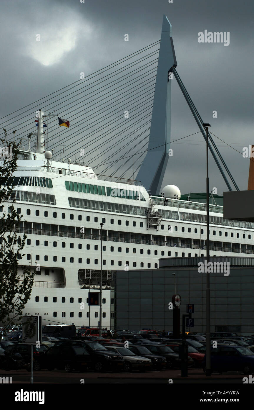 Port of Rotterdam Kop van Zuid Erasmus bridge a cruise ship from the Holland Amerika at the dock Stock Photo