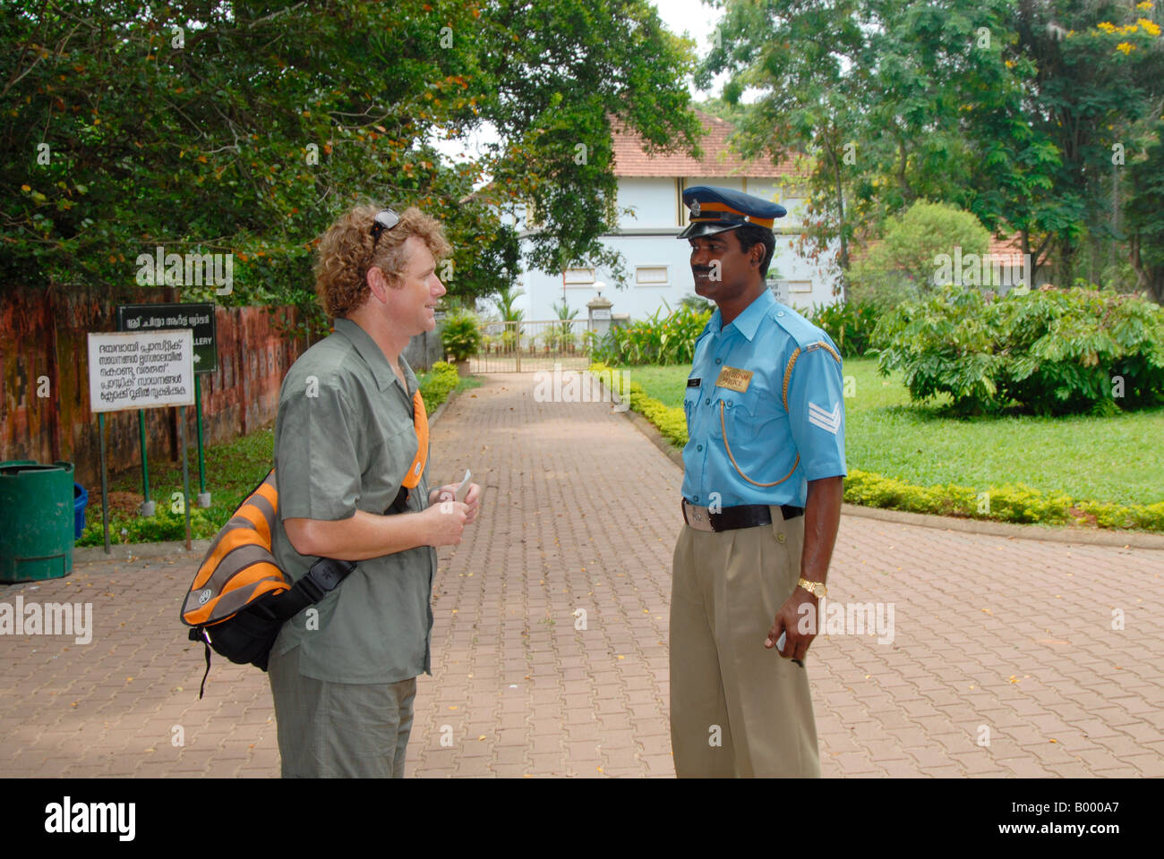A tourist is interacting with Tourism Police in Trivandrum,Kerala,india Stock Photo