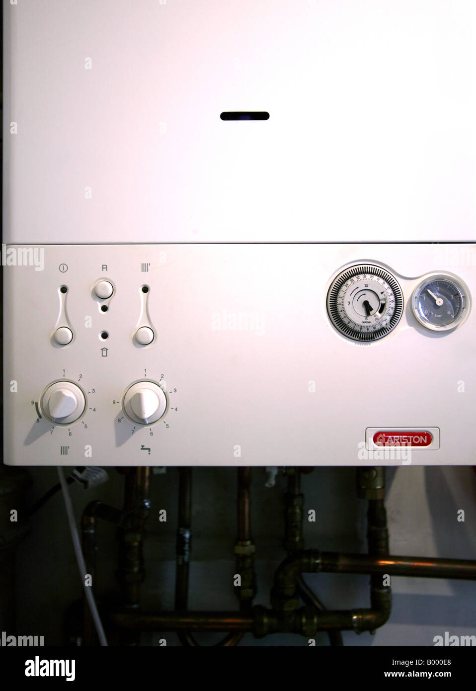 Combination boiler with switches, timer and pressure guage Stock Photo