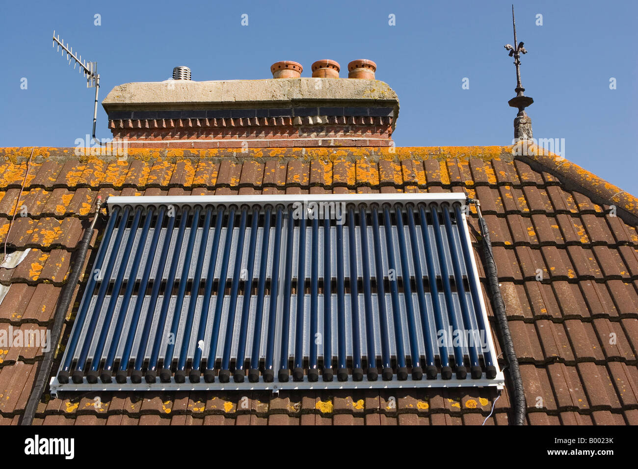 Thermal evacuated solar collecting tubes to power hot water system in photographers own home Stock Photo