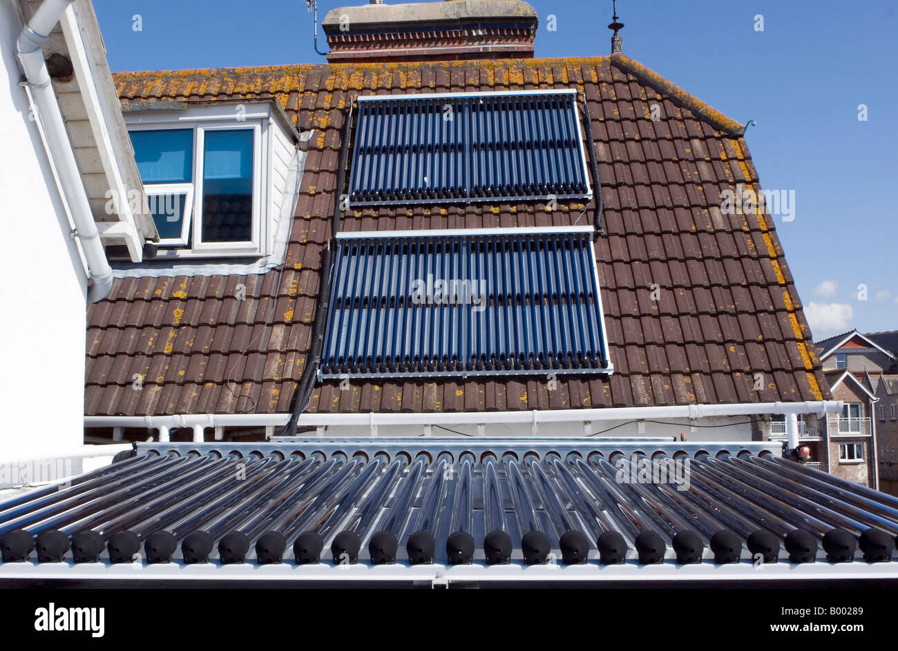 Solar collecting tubes on a Guest House rooftop in Dorset Stock Photo ...