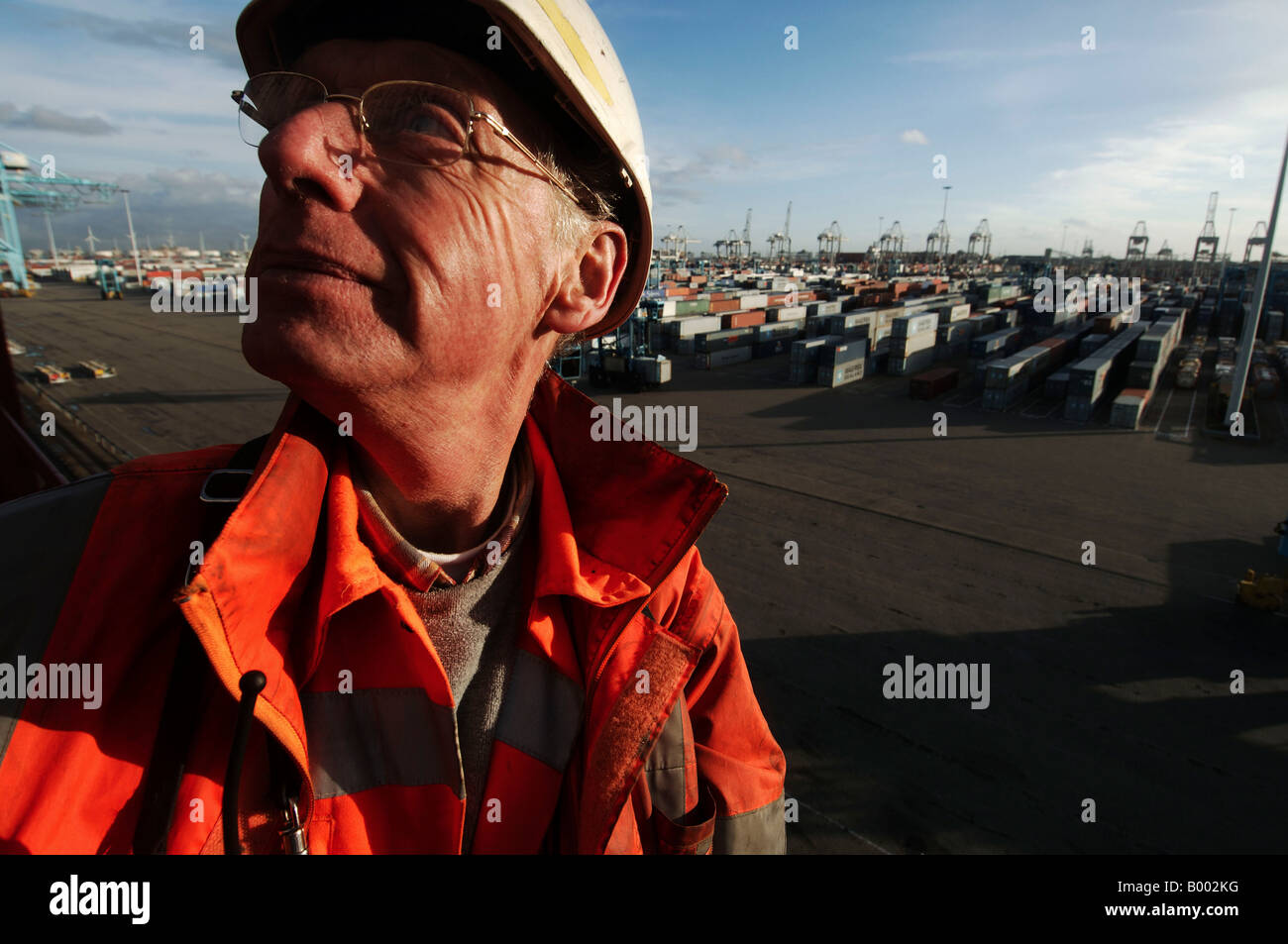 Port of Rotterdam a worker at the Maersk Container terminal on the Maasvlakte Stock Photo