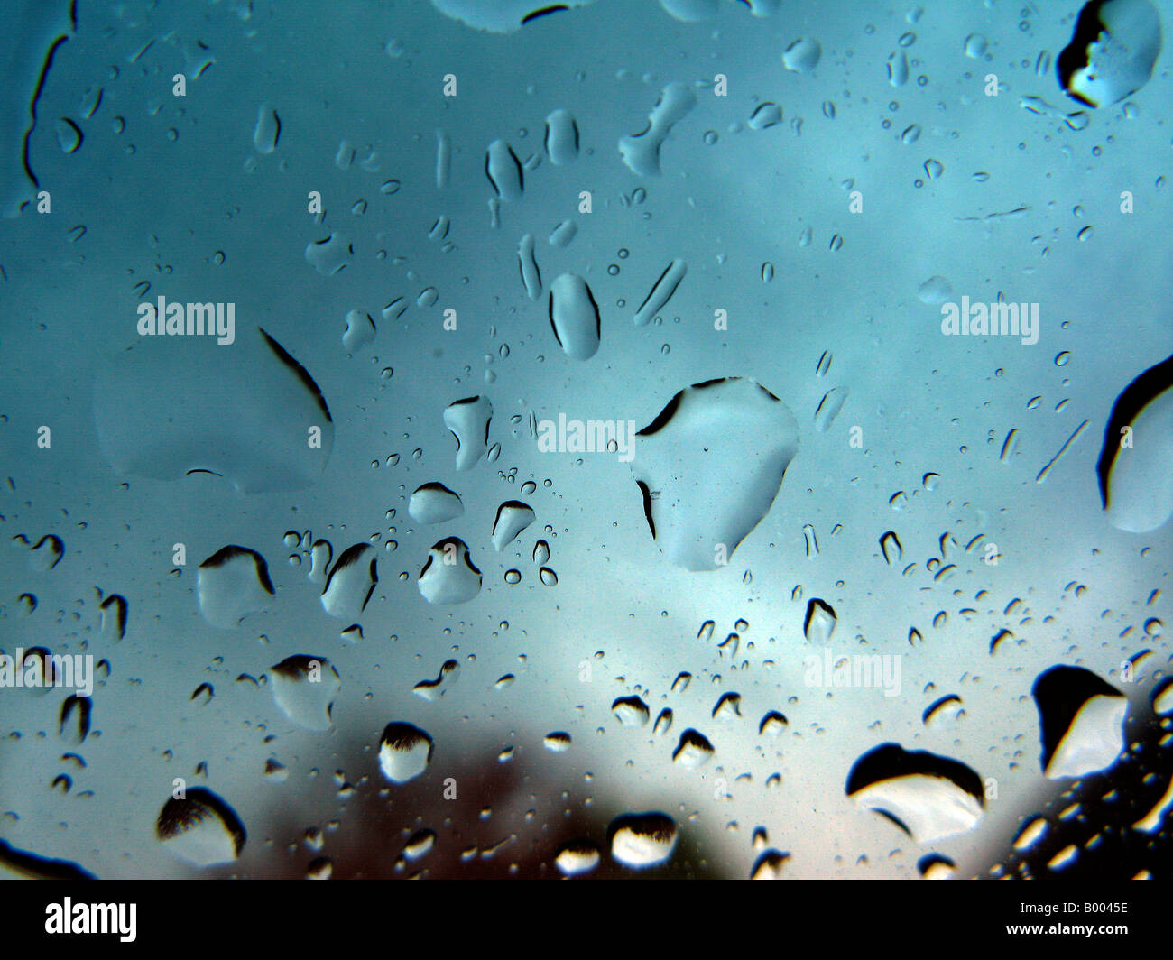 Raindrops on cars windshield. Stock Photo
