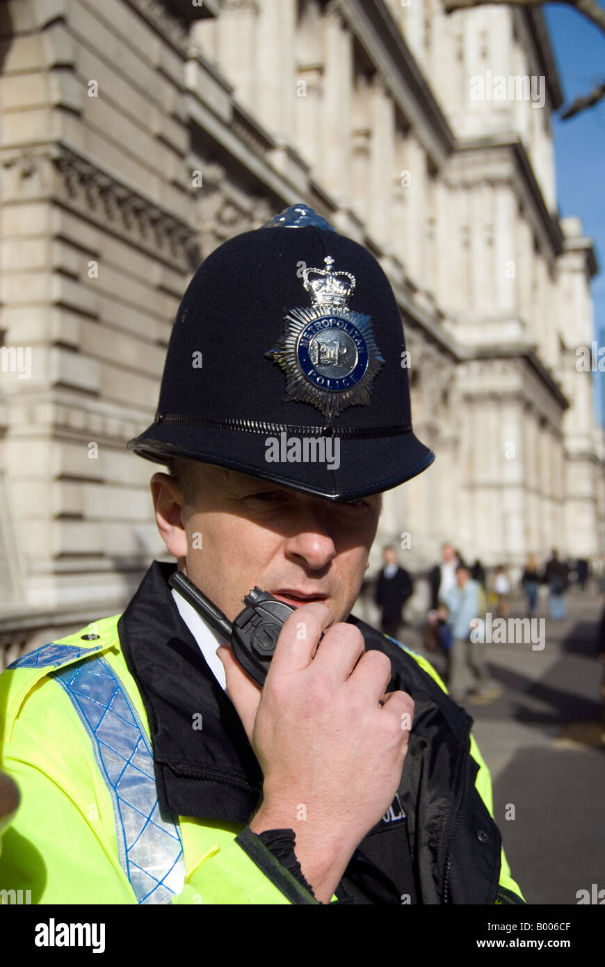 Policeman talking on walkie-talkie London England UK Stock Photo