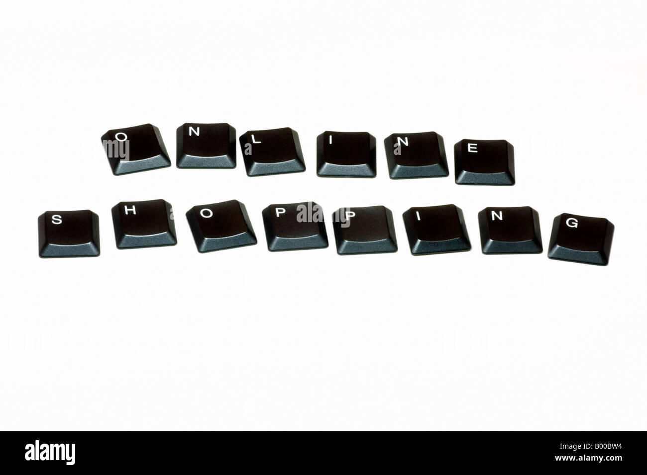 Computer keys spelling out 'Online Shopping' against a white background Stock Photo