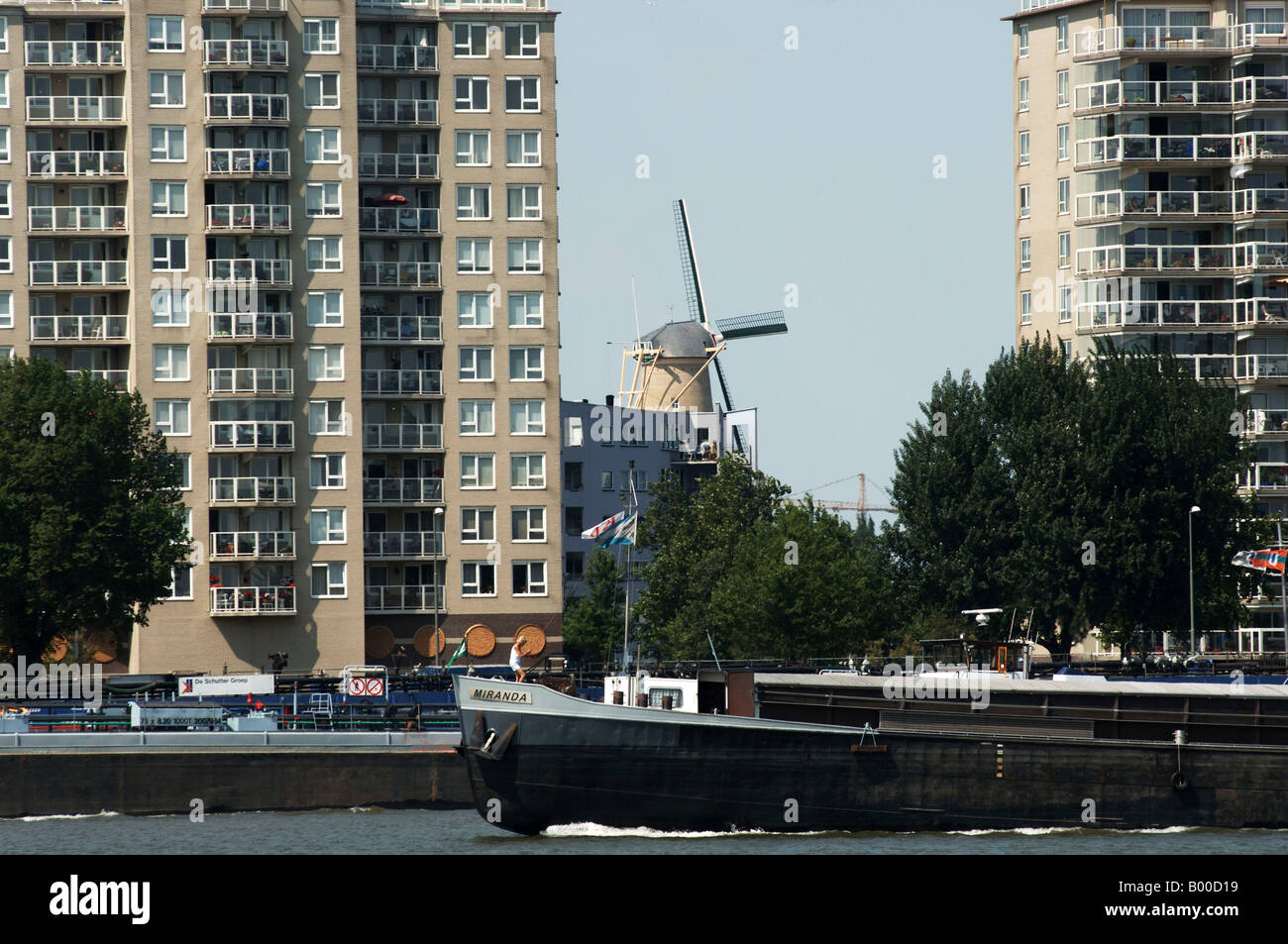 Port of Rotterdam a ship passing apartment buildings Stock Photo Alamy