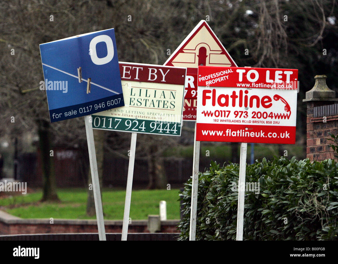 Estate agents boards on display outside a building in Bristol, England