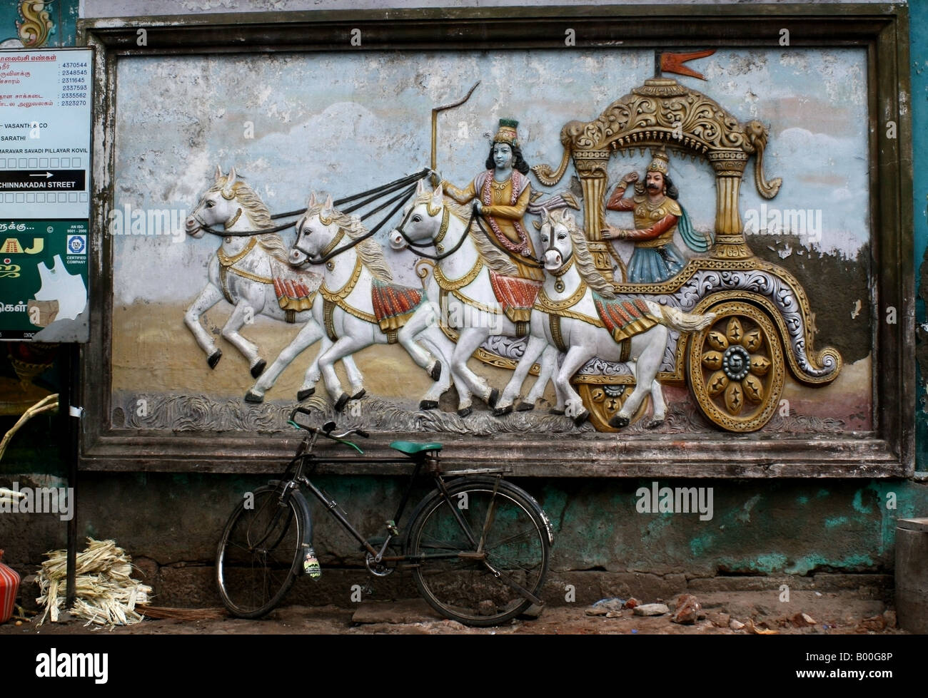 Bas relief of Arjuna riding the chariot to battle on a temple in Madurai , Tamil Nadu , South India Stock Photo