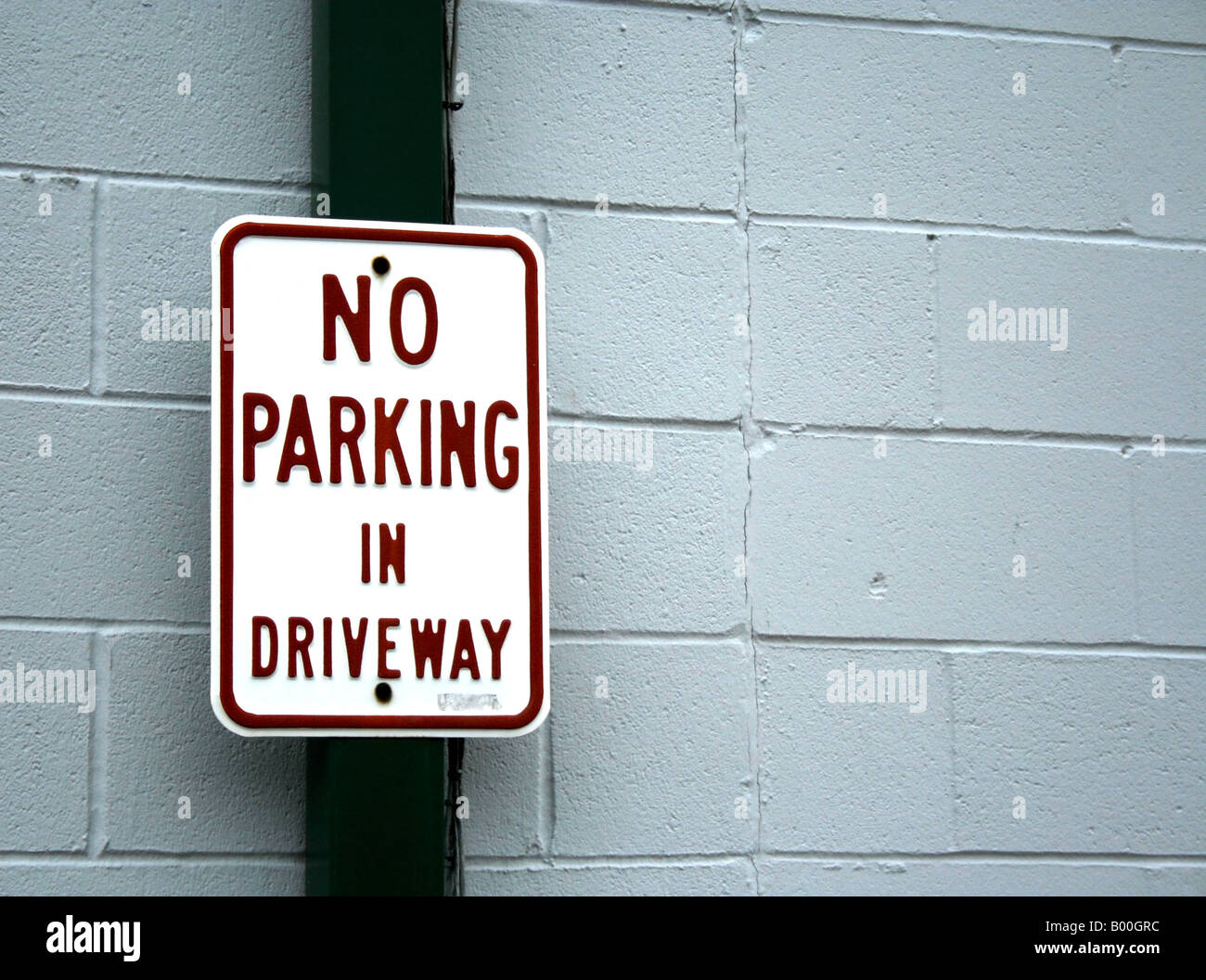 Red white wall sign no parking hi-res stock photography and images - Alamy