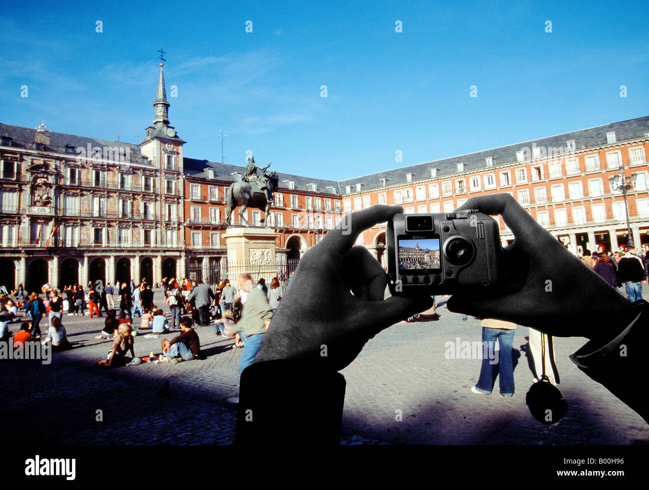 Hands taking photograph of the Plaza Mayor. Madrid. Spain. Stock Photo