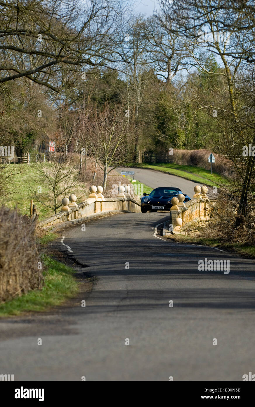 A Lotus Elize travelling across the river bridge at Honington near