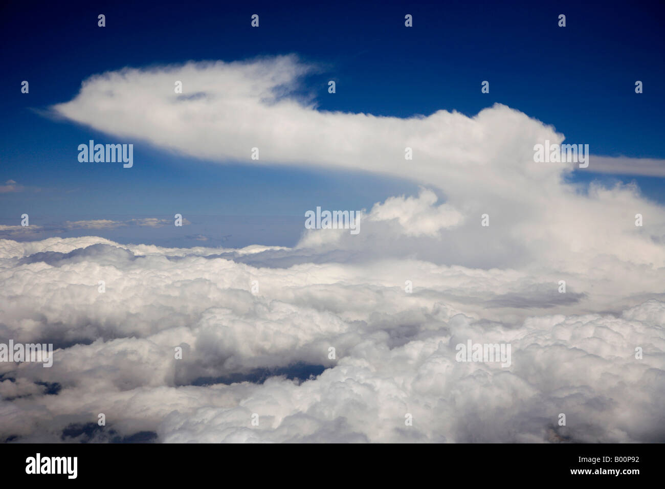 Cumulonimbus Incus clouds seen from an aeroplane over the Peruvian Andes mountain range South America Stock Photo