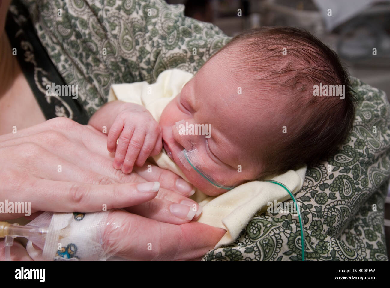 mum-holds-her-premature-baby-stock-photo-alamy