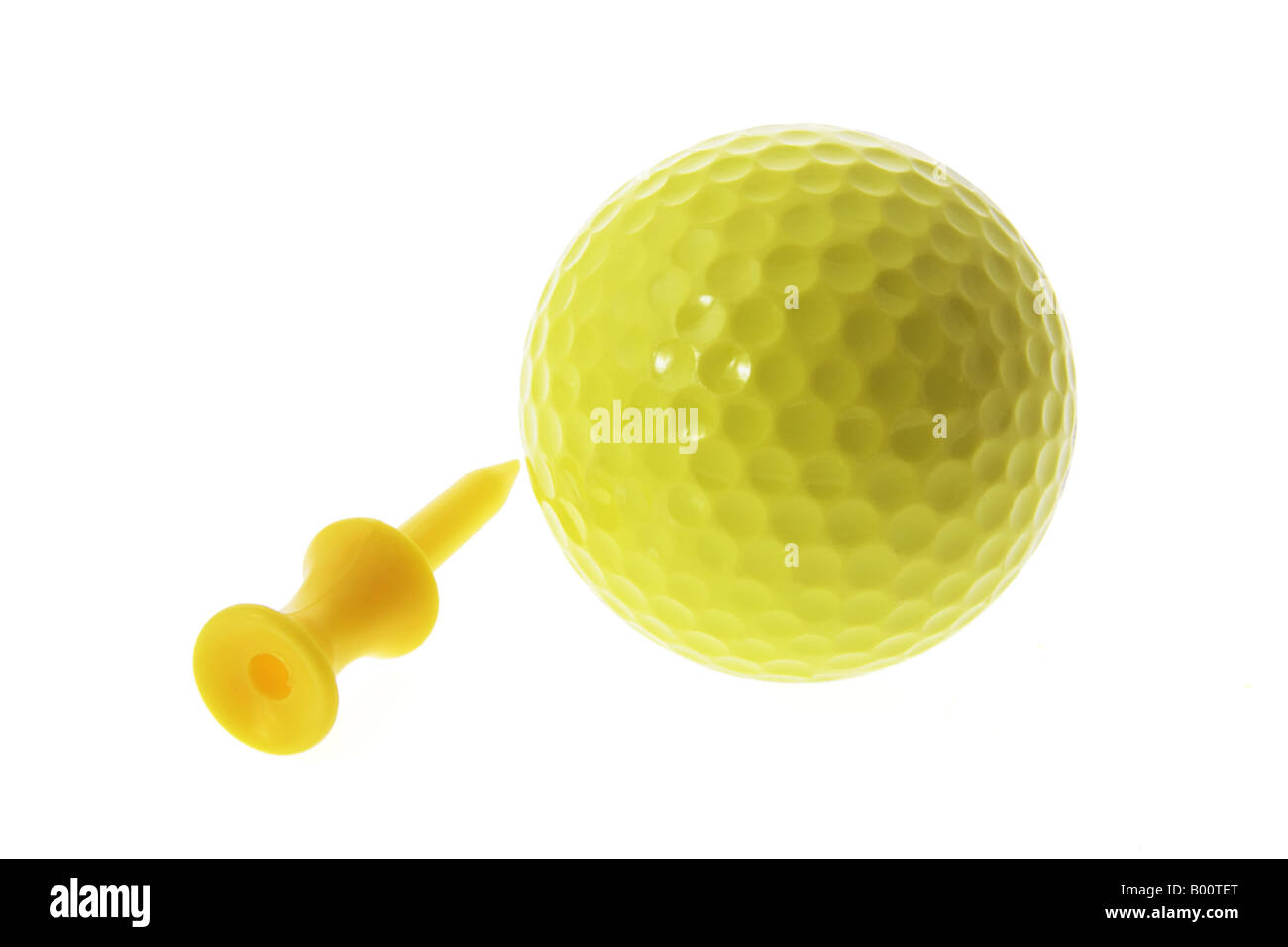 Yellow Golf Ball and Tee Stock Photo - Alamy