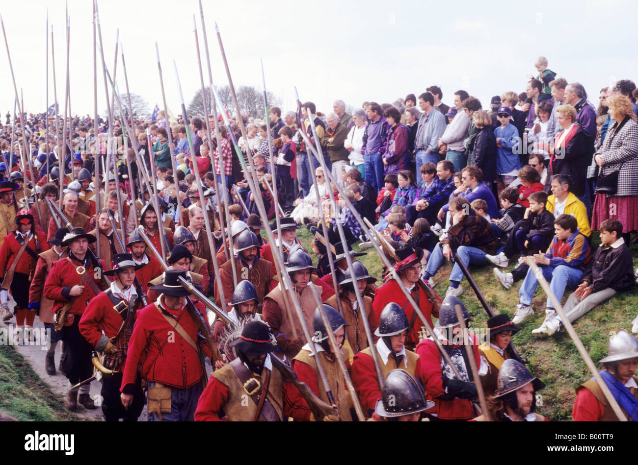 Historical re-enactment marching pikemen English Civil War foot soldiers spectators pikes weapons 17th century Cromwell battle Stock Photo