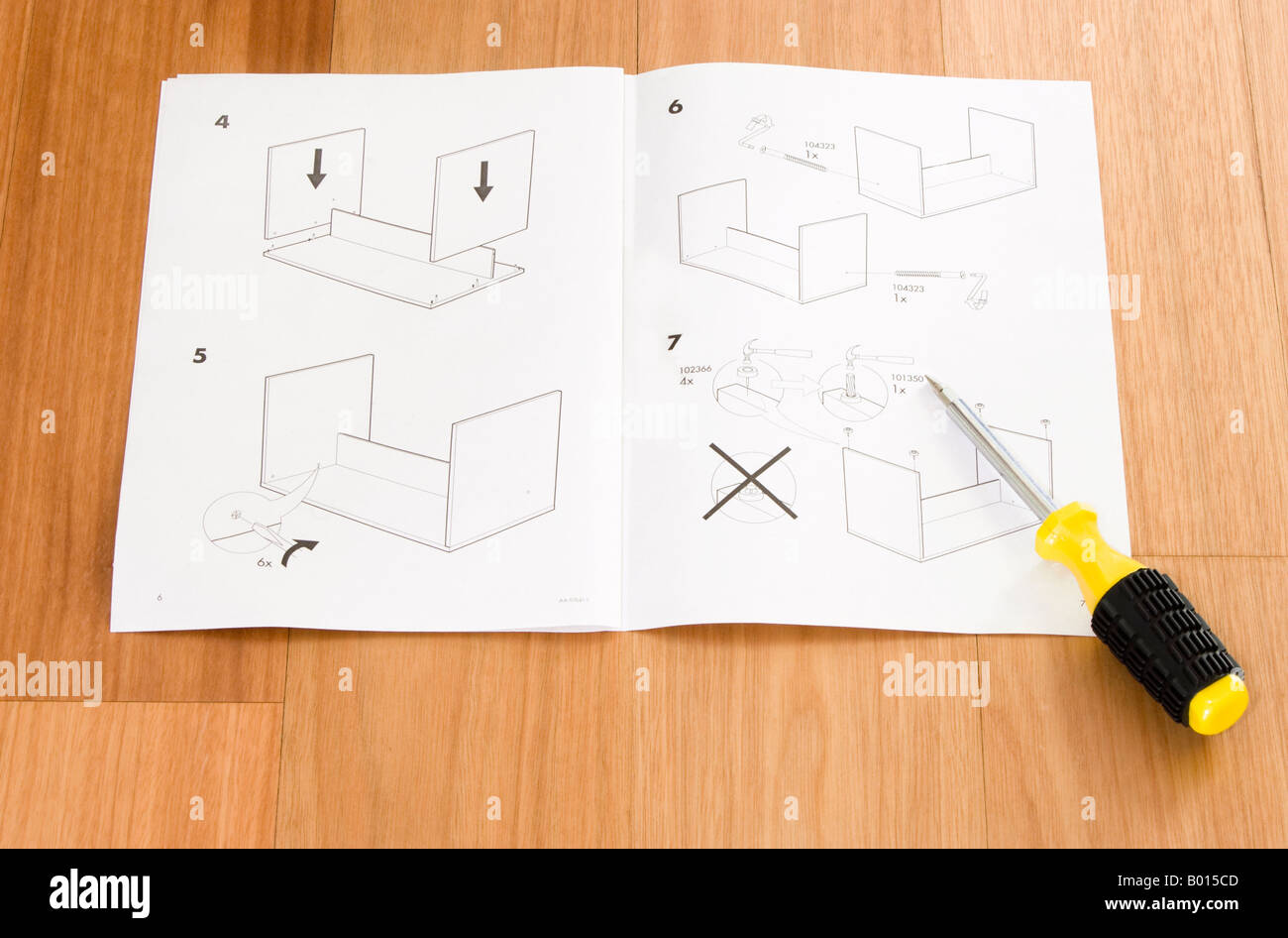 Self Assembly Ikea Furniture Instructions And Screwdriver Stock