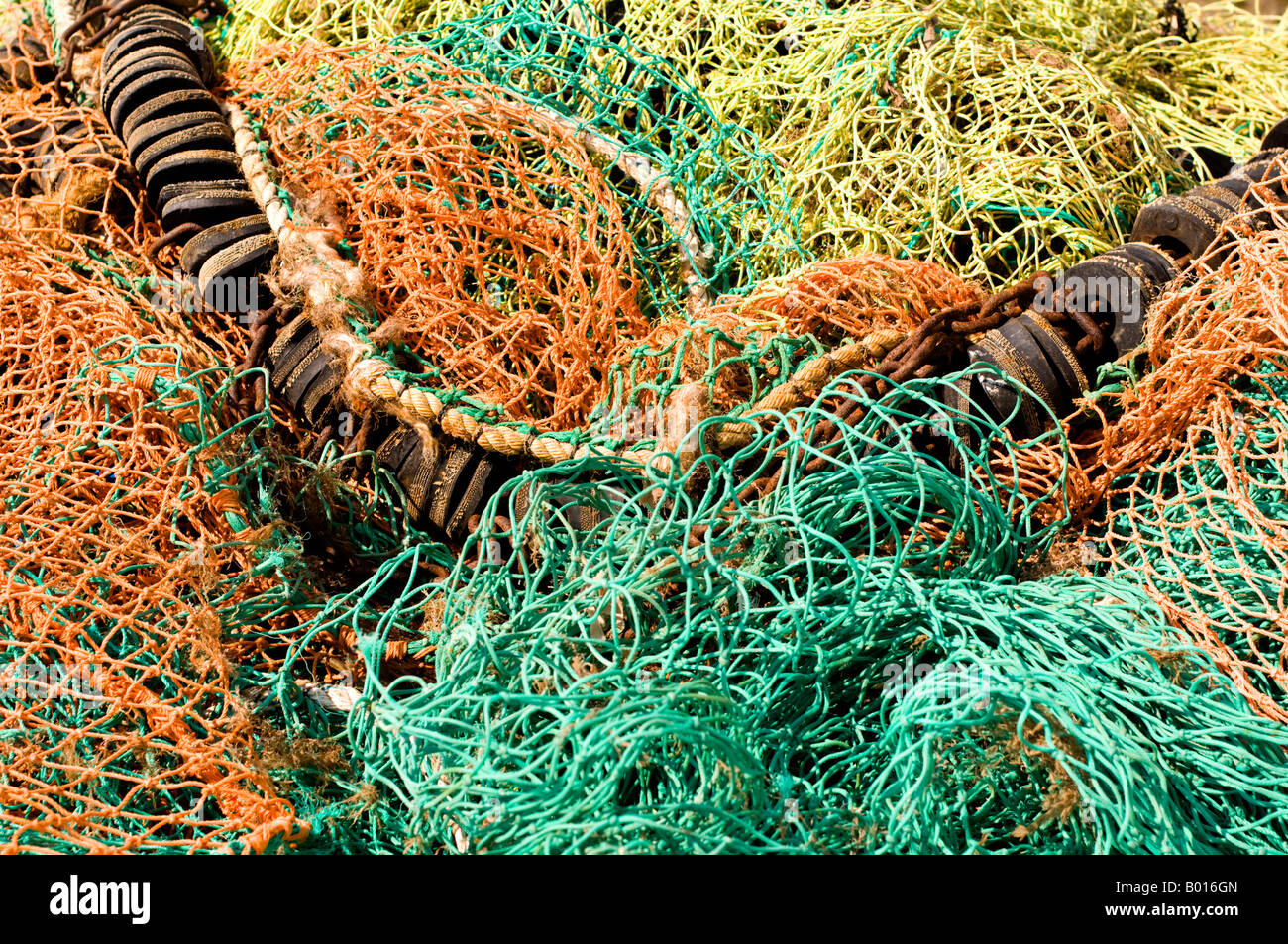 Pile of tangled fishing nets on quayside, West Mersea, Essex. Stock Photo
