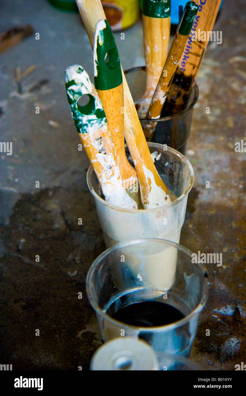 Dirty Paint Brushes on Smudged Floor, Netherlands Stock Photo