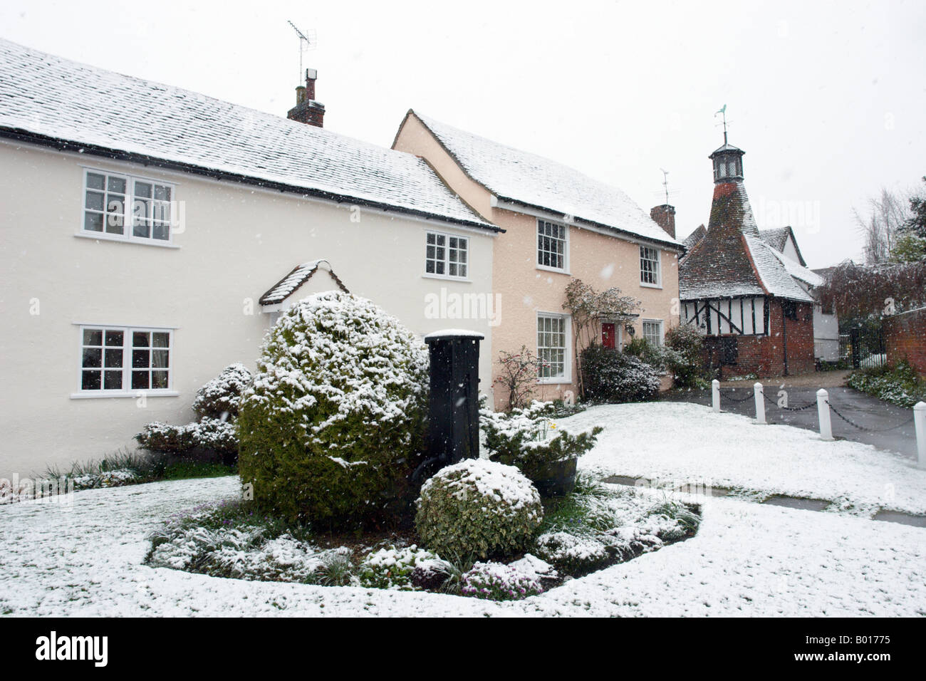 Houses under snowfall in the picturesque village of Writtle Essex Stock