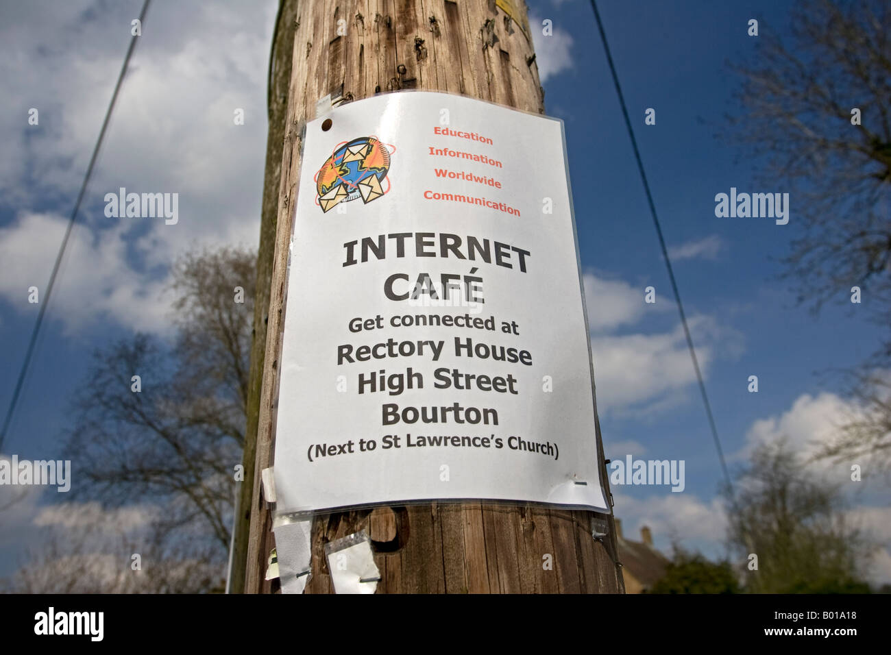 Get connected internet cafe notice on telegraph pole Bourton Cotswolds UK Stock Photo