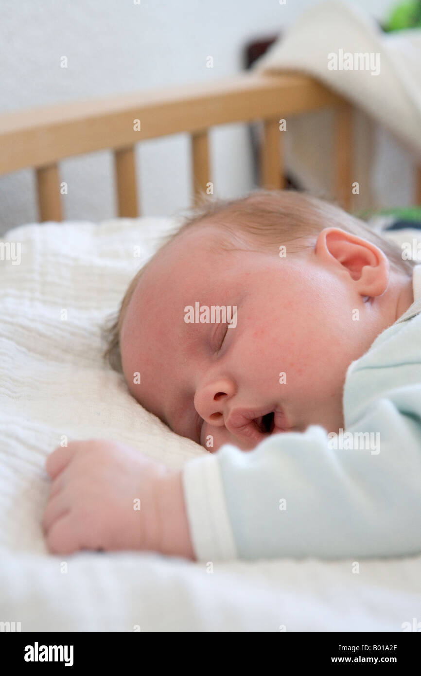 Baby sleeping on his belly Stock Photo Alamy