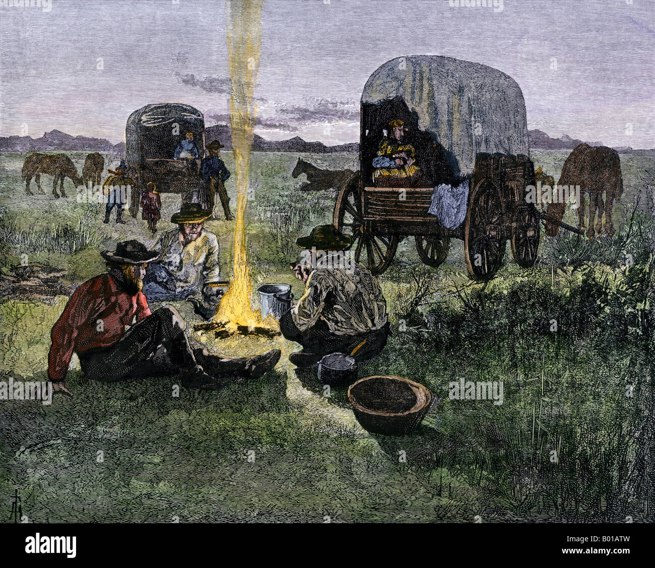 Santa Fe Trail pioneers around a campfire on their way west. Hand-colored woodcut Stock Photo