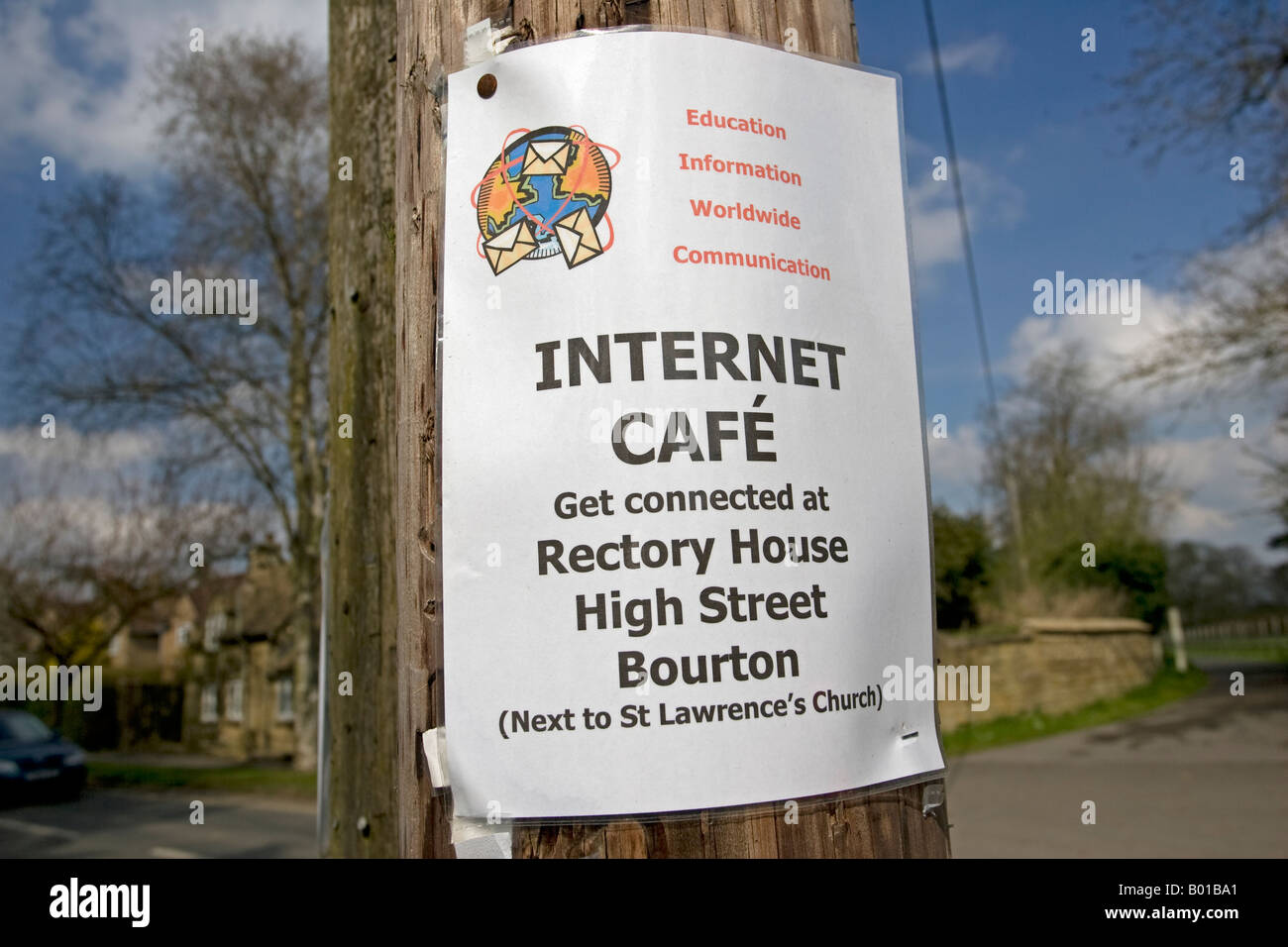 Get connected internet cafe notice on telegraph pole Bourton Cotswolds UK Stock Photo