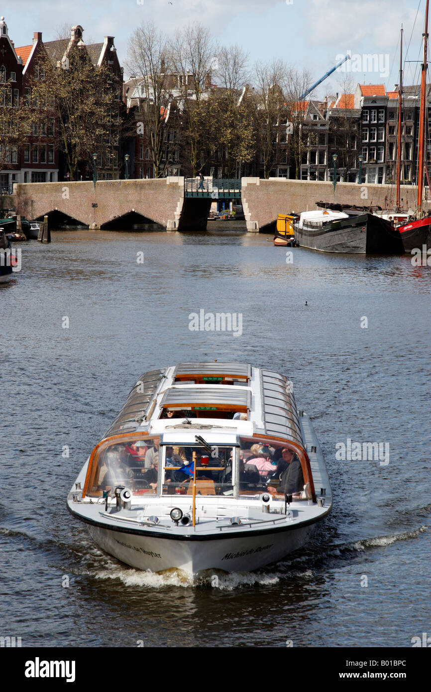 Glass top boat on canal amsterdam hires stock photography and images