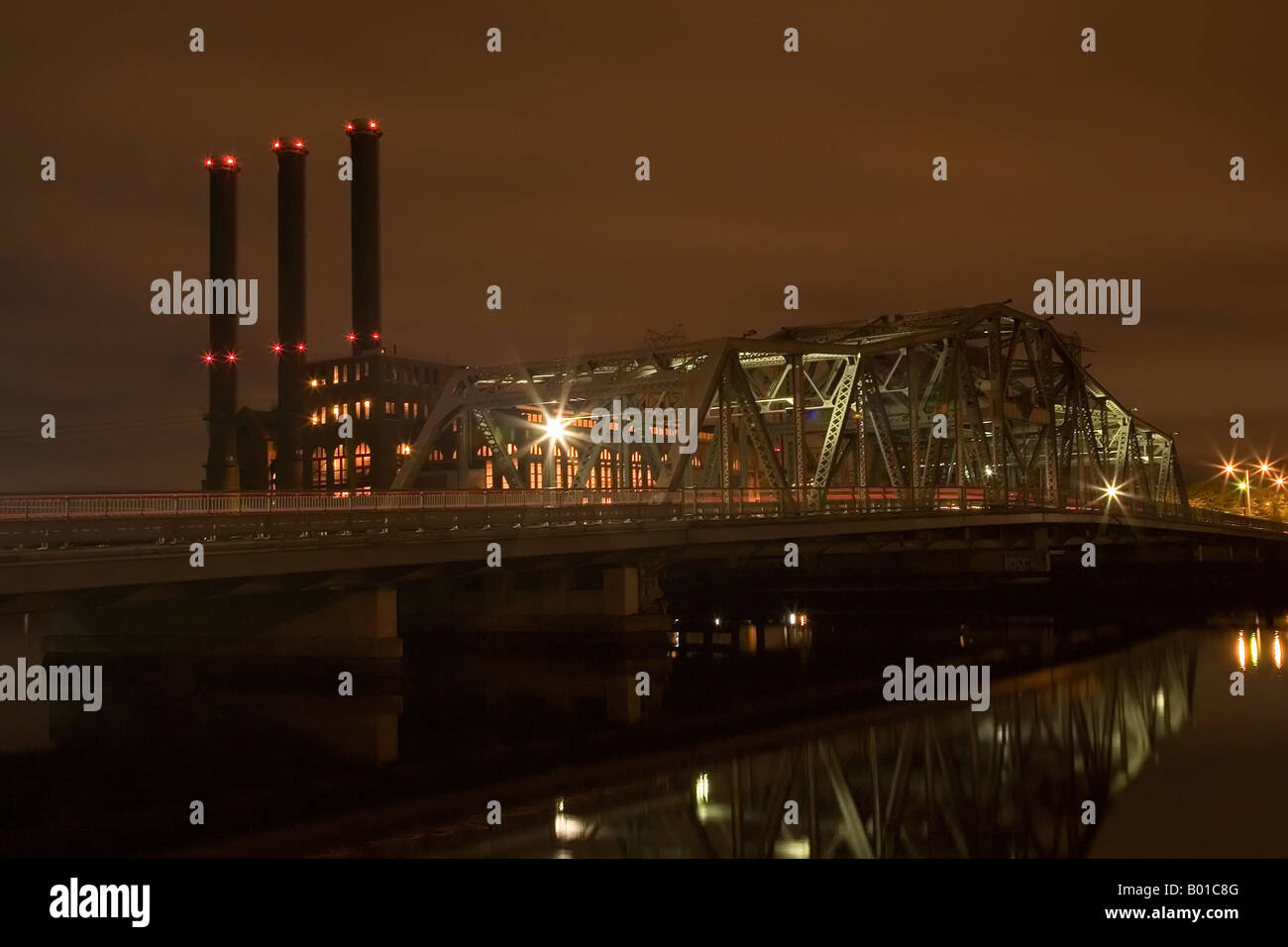 Night photo of the Point Street Bridge with the Power plant in the