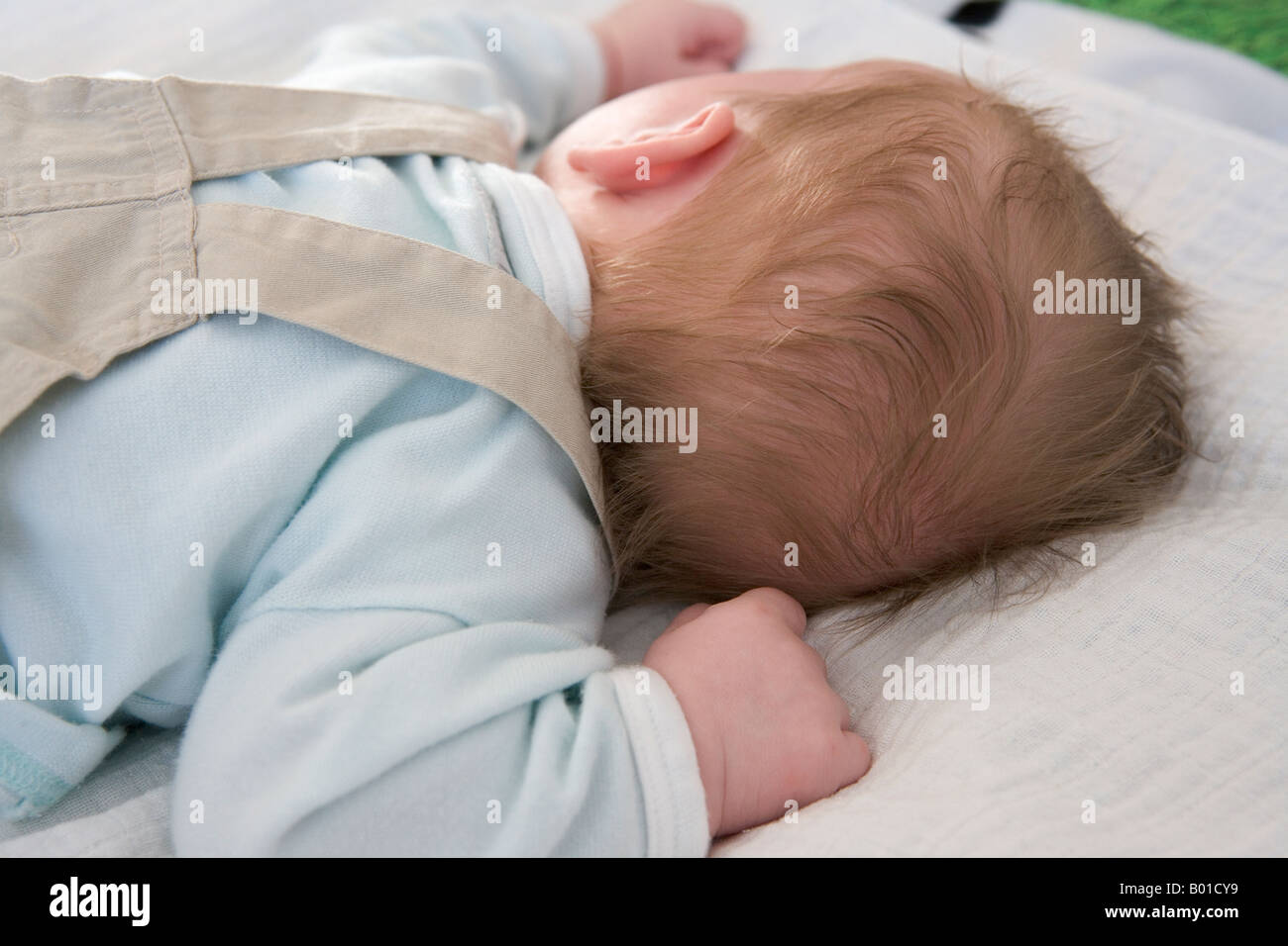 Baby sleeping on his belly Stock Photo Alamy