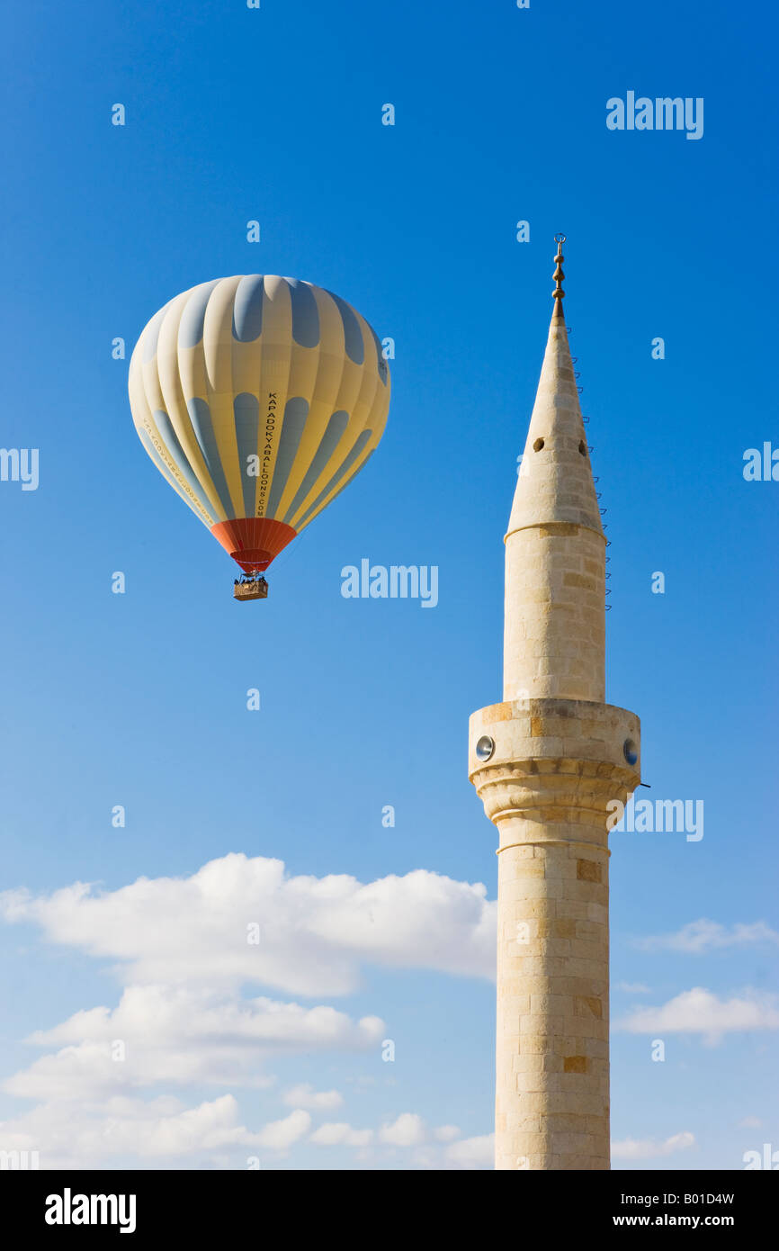 Hot Air Balloon and Mosque in the town of Urgup, Cappadocia, Turkey Stock Photo