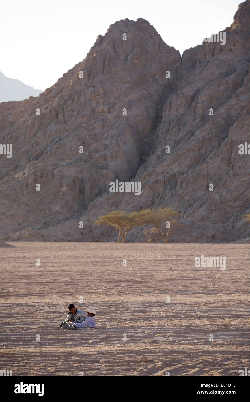 Two Egytpian Bedouin Boys Relaxing In The Sinai Desert Egypt Stock ...