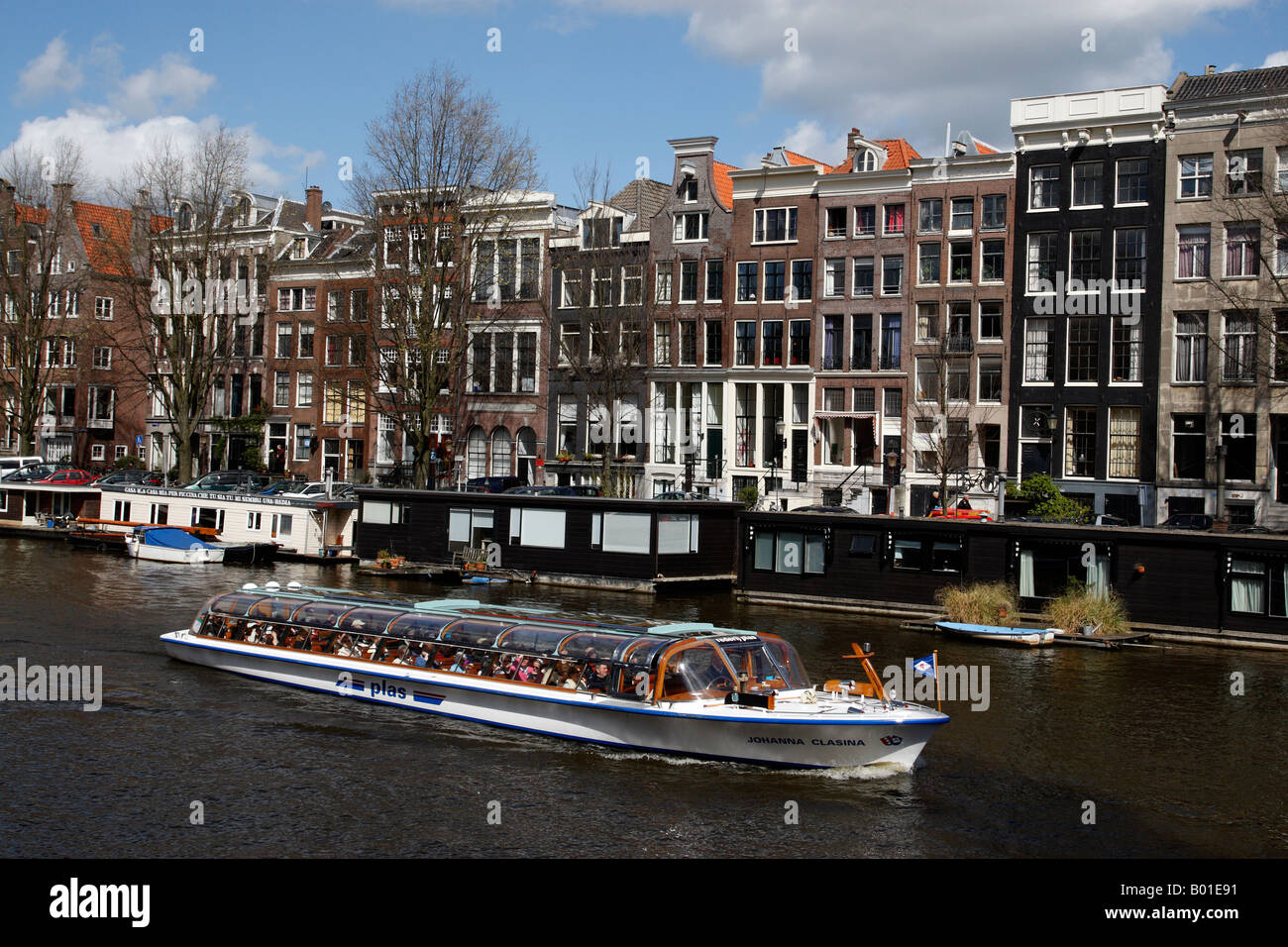 Glass top boat on canal amsterdam hires stock photography and images