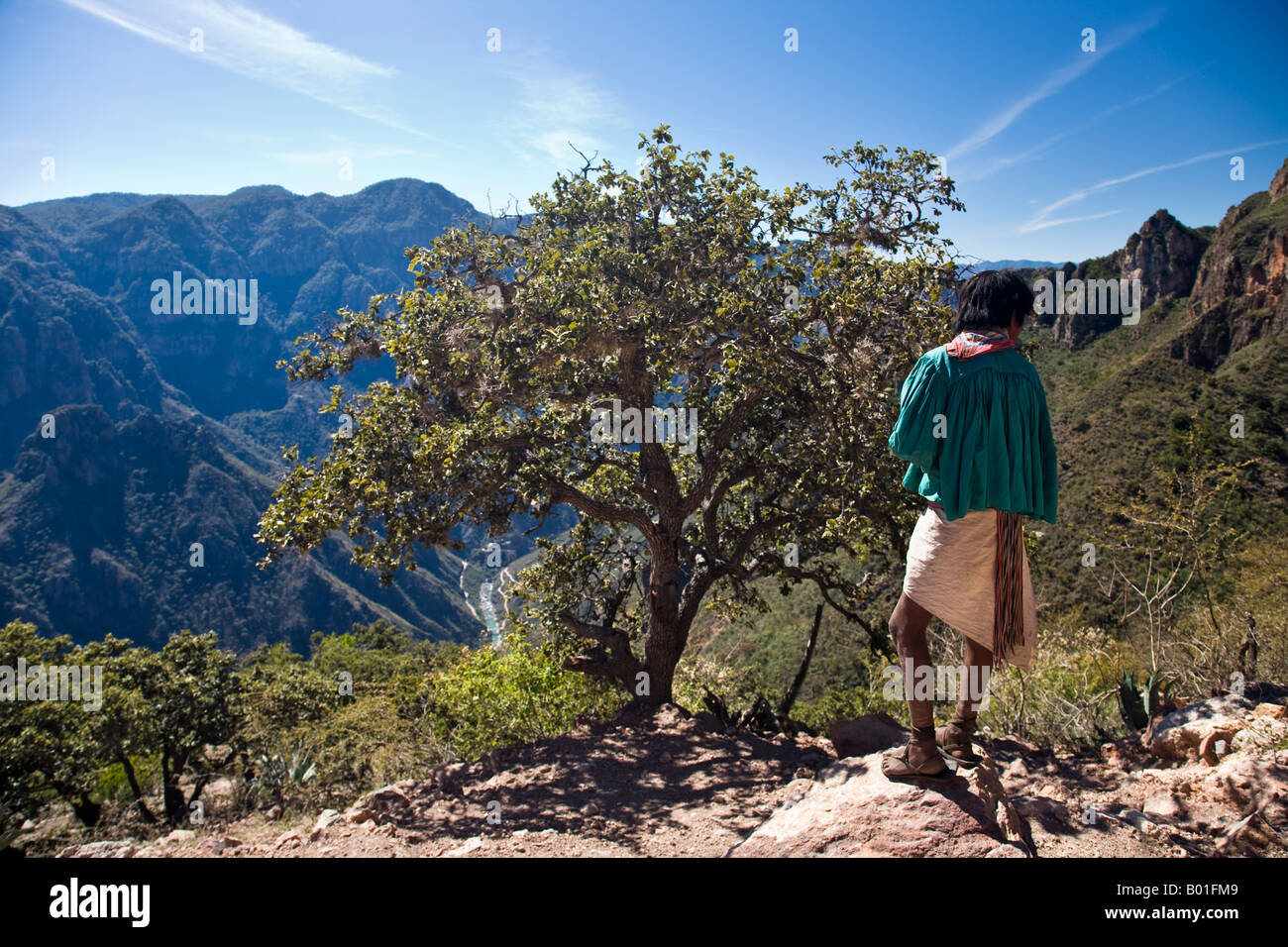 Tarahumara indian boy stands by viewpoint in the Copper Canyon area